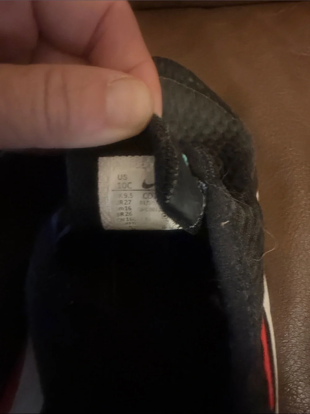 Nike Kids Black Slip-On Sneakers with Blue, Red, and Teal Accents